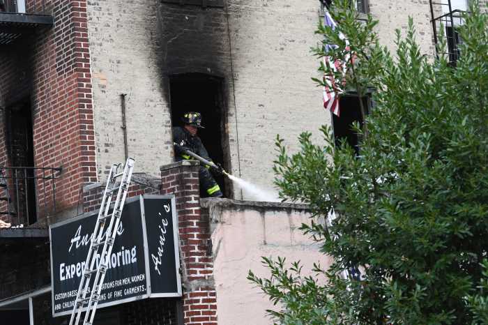 firefighter on top of building