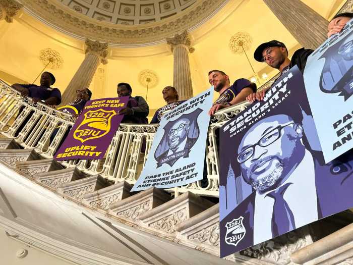 union members holding security guard flags