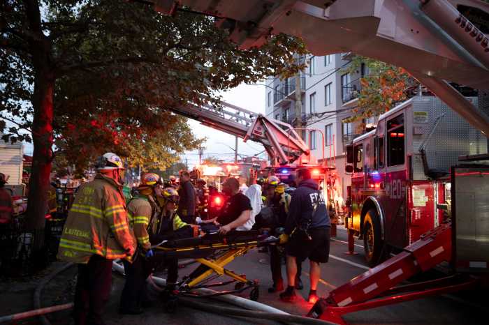 person on stretcher after fire