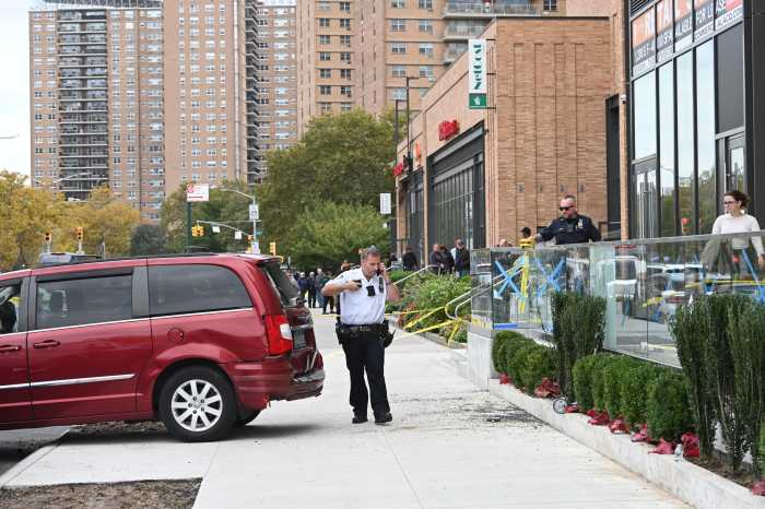 car on sidewalk after crash