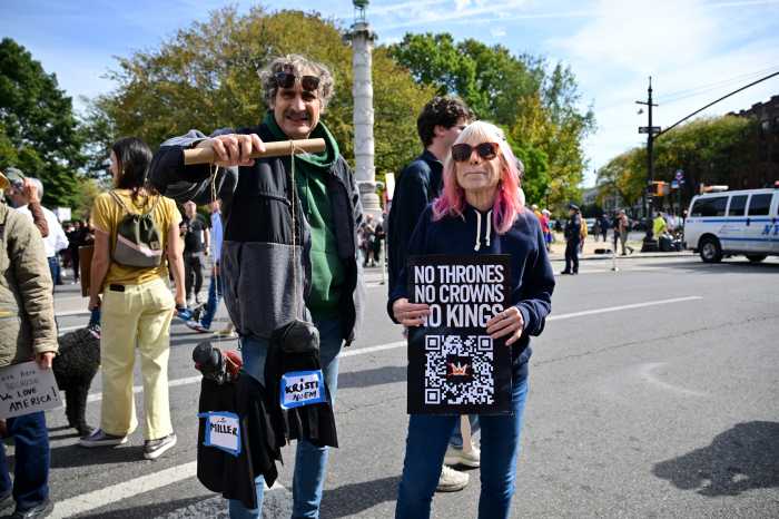 person with halloween decorations labeled as kristi noem and stephen miller