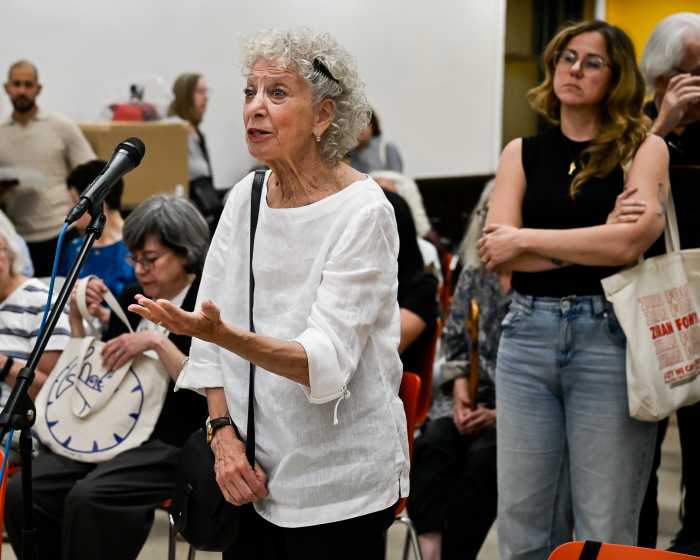 woman speaking at grocery store meeting