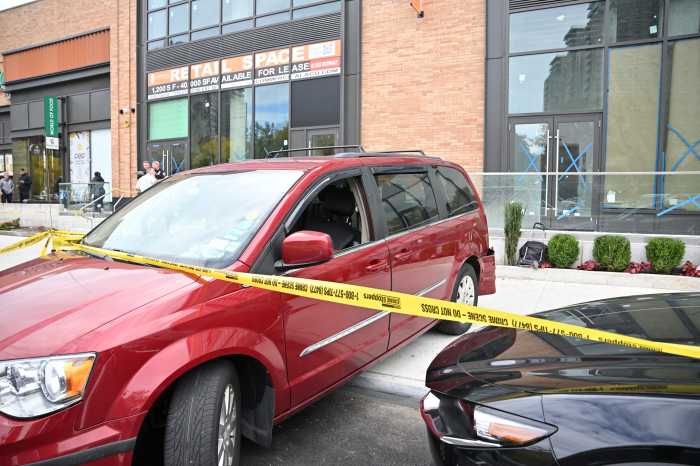 car on coney island sidewalk