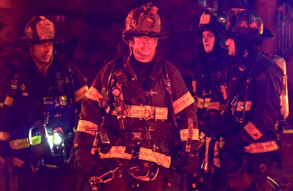 A firefighter from Squad Company 1 after operating during a three alarm fire at 190 New York Avenue.