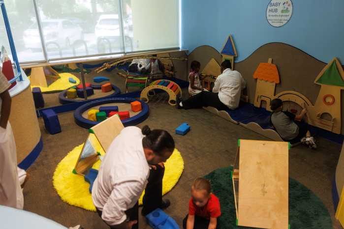 parents play with kids at BCM