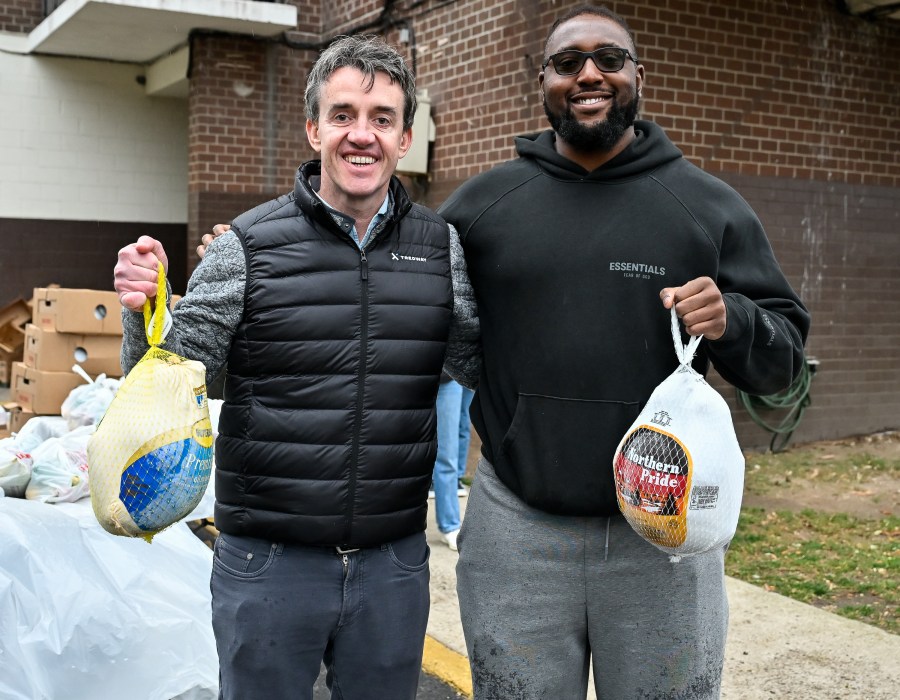 NY Giants’ Joshua Ezeudu helps distribute turkeys for Thanksgiving to families in need