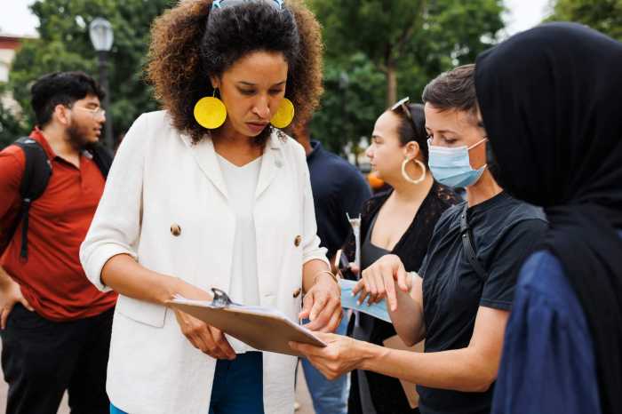 Sandy Nurse talking with tenants