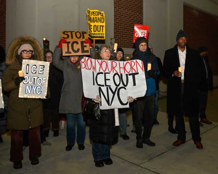 people holding anti-ice signs outside MDC
