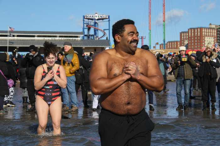 man in water at coney polar plnuge