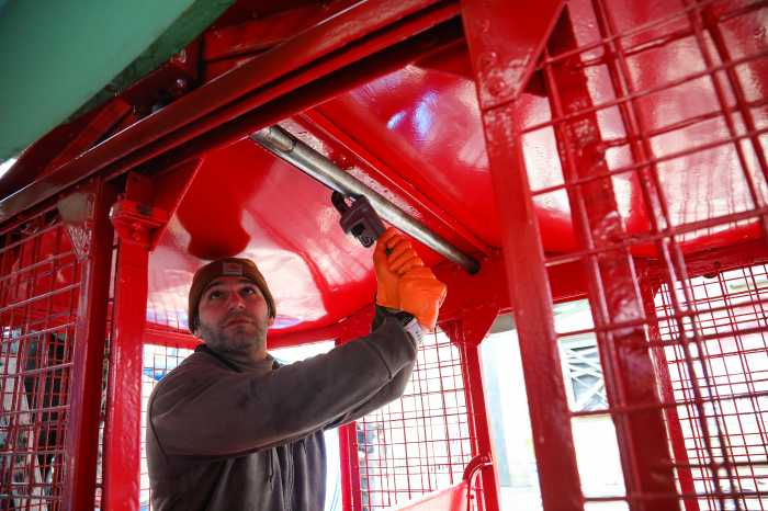 man working on wonder wheel at deno's wonder wheel park